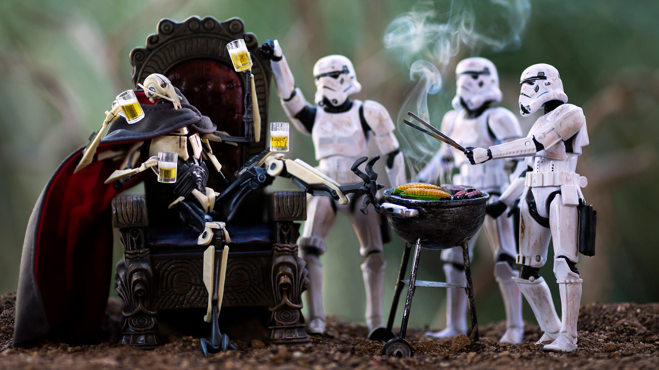 Star Wars action figures with General Grievous sitting and Stormtroopers grilling and toasting with drinks outdoors