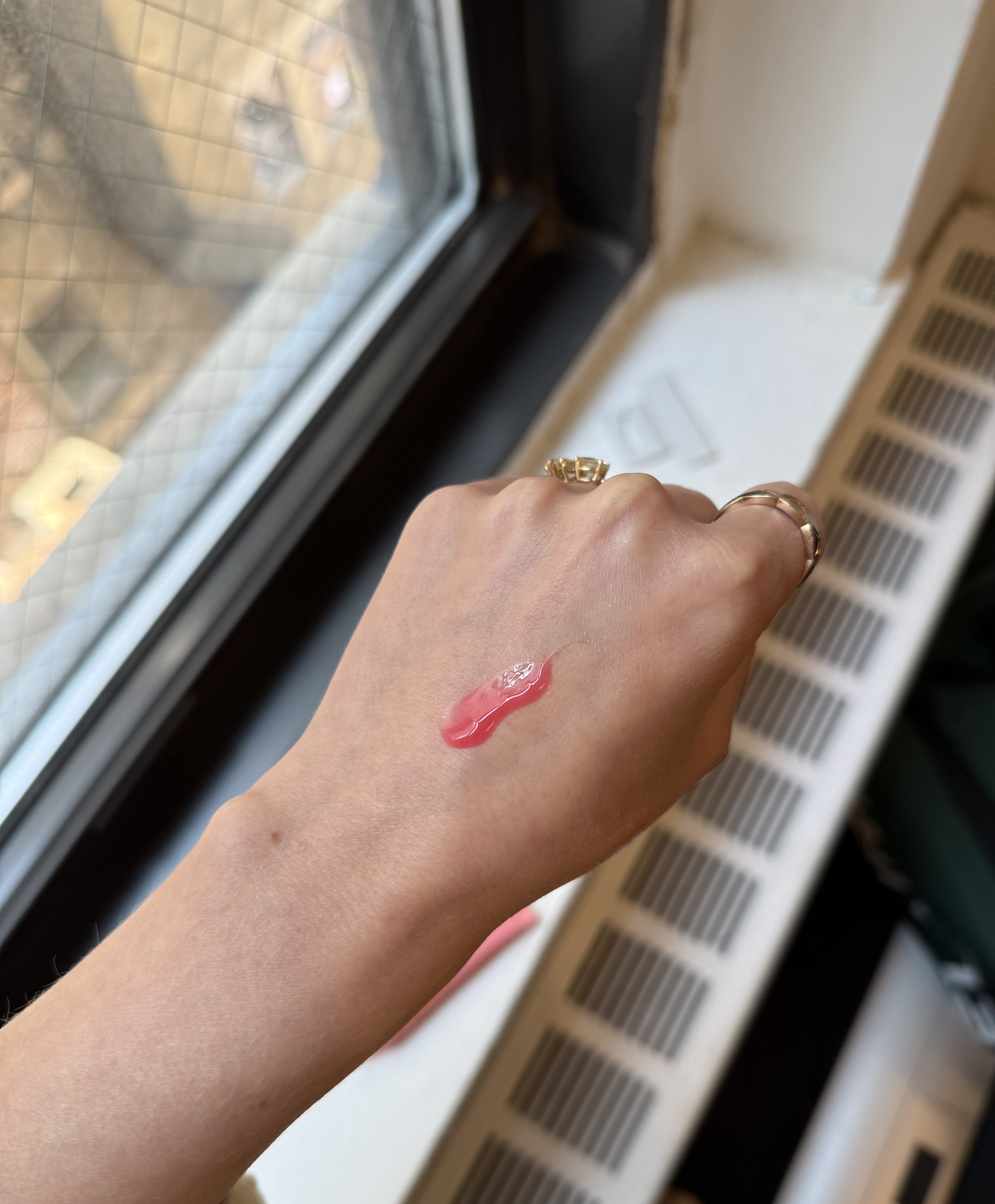 Jamie Schneider testing Summer Fridays Lip Butter Balms.