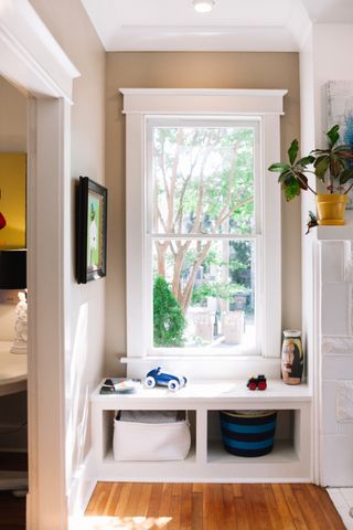 small apartment organization with window shelving by JL Design