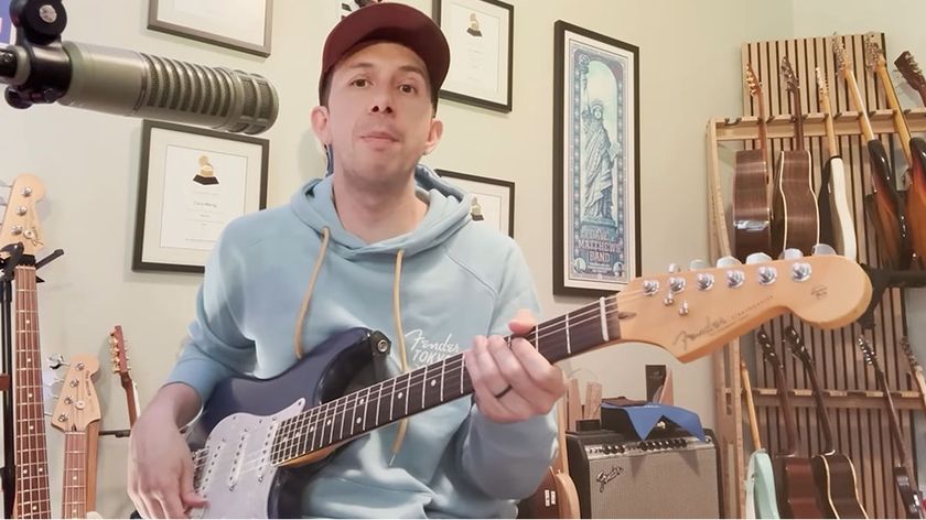 A still of Cory Wong's exclusive video lesson for Guitar World. He plays his blue Strat, wears a light blue Fender hoodie and ballcap.