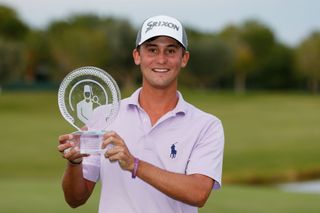 Smylie Kaufman holds the trophy after winning the 2015 Shriners Open