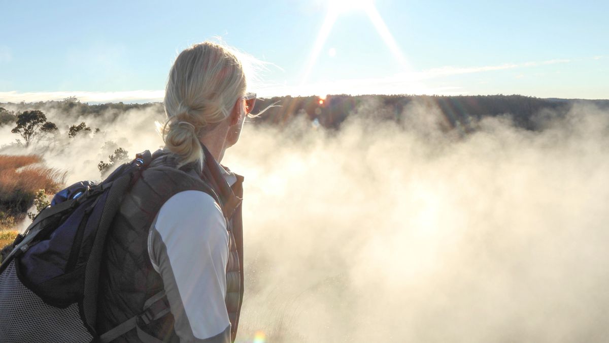 Woman explores Crater Rim Trail, caldera of Kīlauea