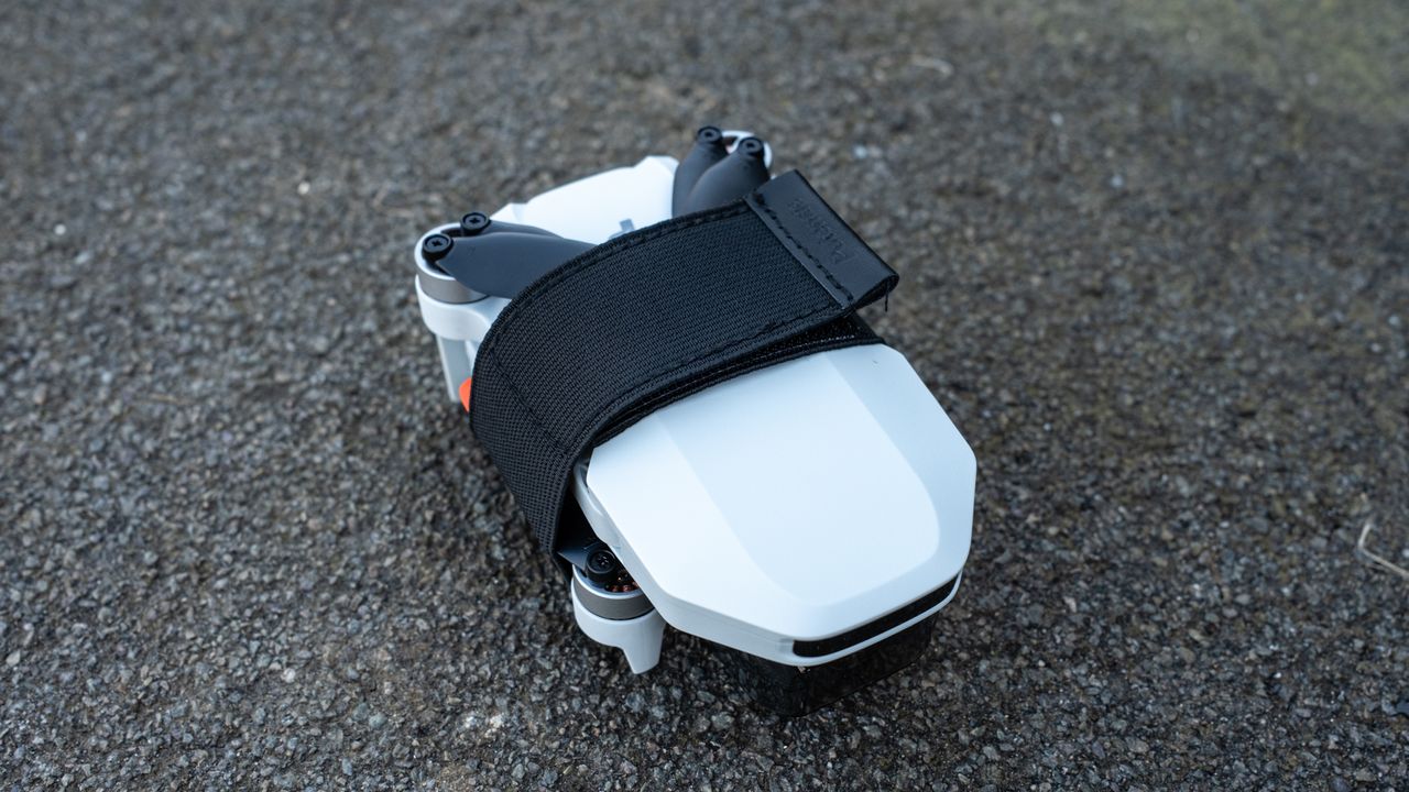 Potensic Atom 2 drone folded with propeller strap attached