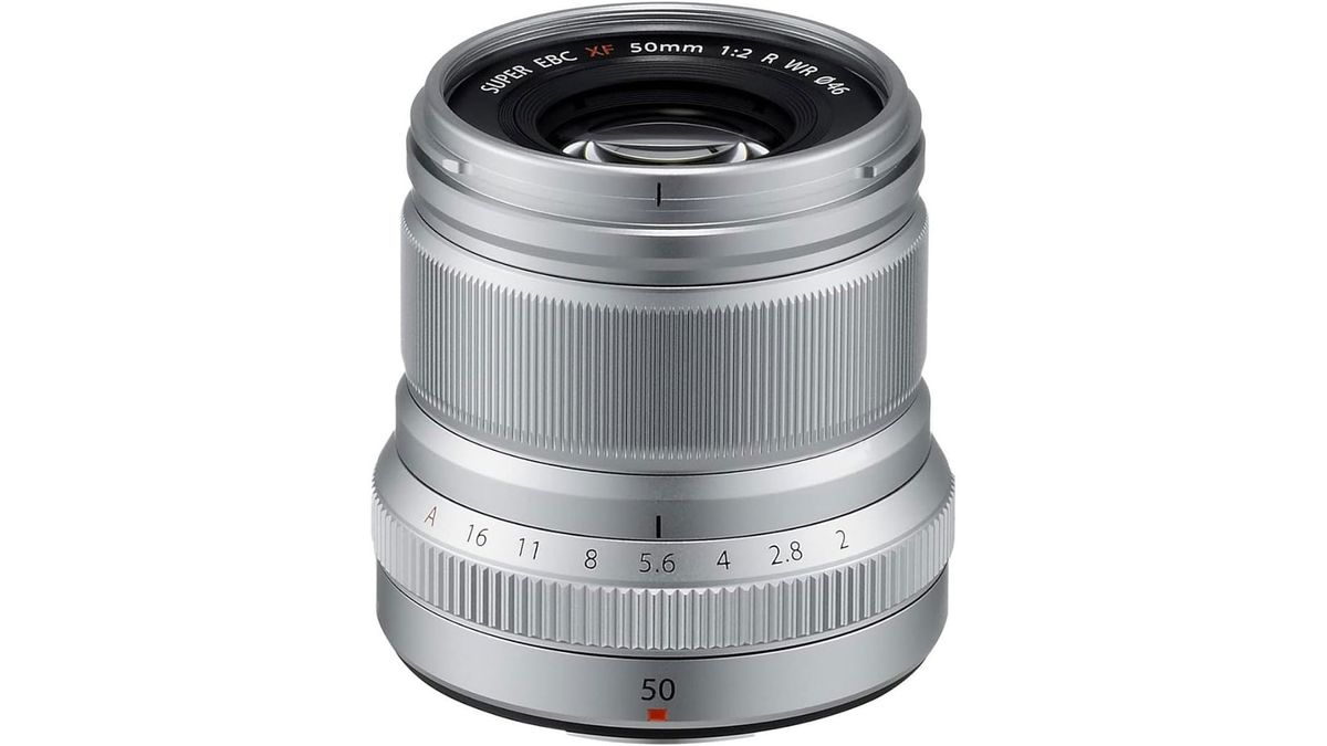 A silver Fujifilm XF 50mm f/2 R WR standing upright