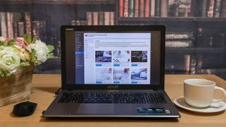 laptop open on desk with WordPress