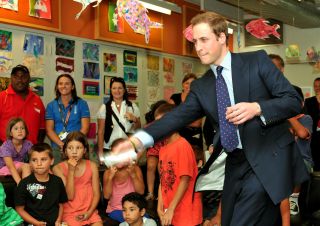 Prince William SYDNEY, AUSTRALIA - JANUARY 19: Prince William plays a Nintendo Wii ten-pin bowling game with children at the Redfern Community centre on January 19, 2010 just outside Sydney in Australia. Prince William flew in from New Zealand for an unofficial three day visit, this is the second visit by the second-in-line to the throne, having been here at the age of 9 months with his parents in 1983. (Photo by John Stillwell-Pool/Getty Images)