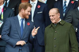 Prince Harry and Prince Philip, Duke of Edinburgh attend the 2015 Rugby World Cup Final match