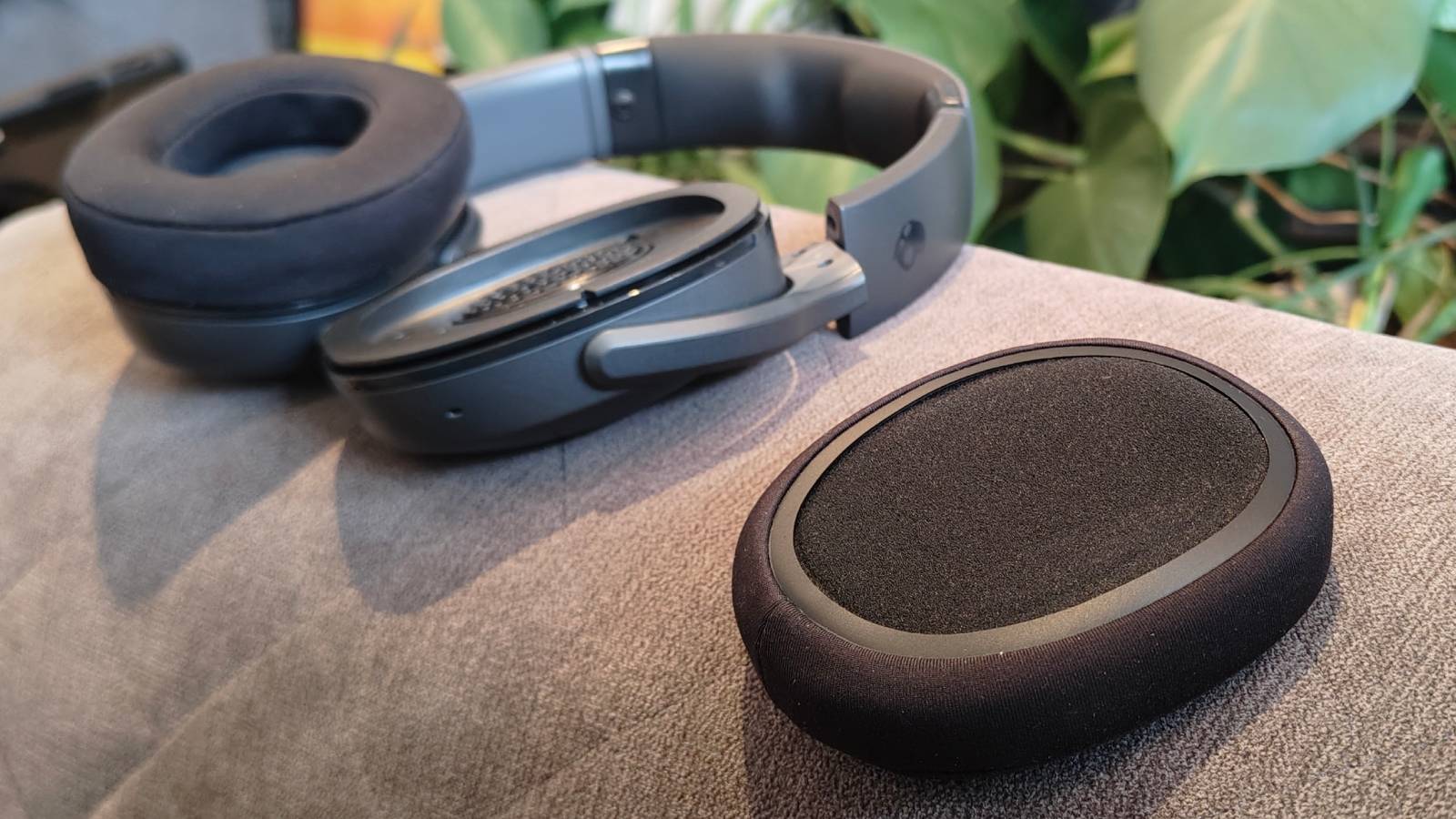 The Skullcandy Crusher 540 Active on a sofa.