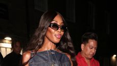 Naomi Campbell wearing a denim maxi dress