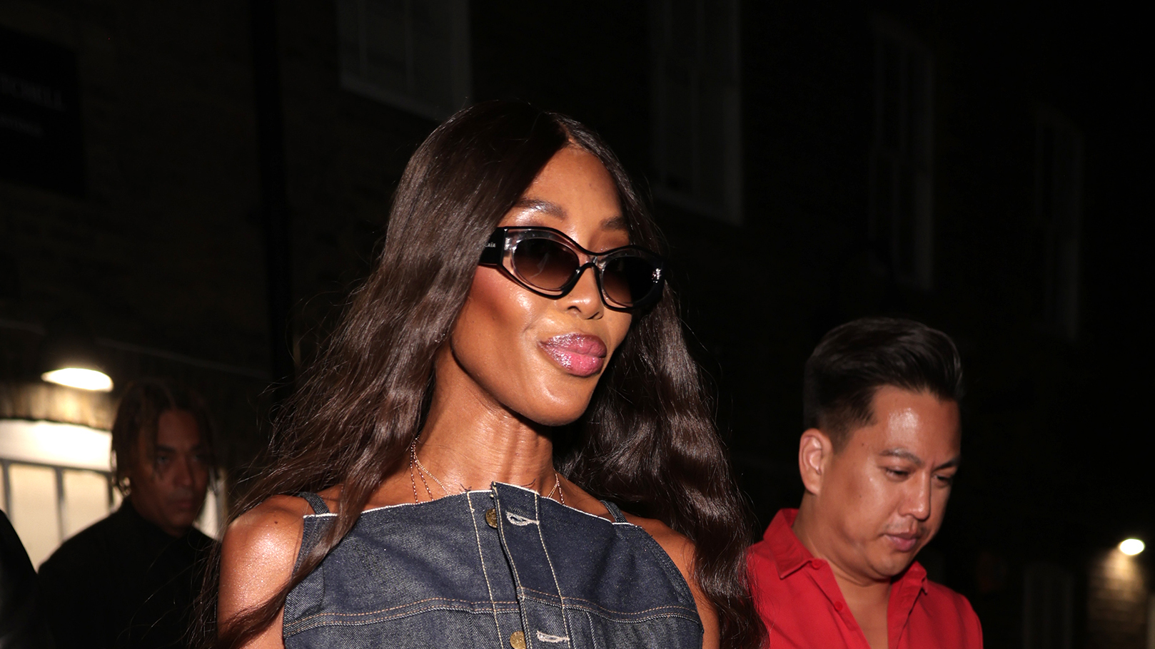 Naomi Campbell wearing a denim maxi dress