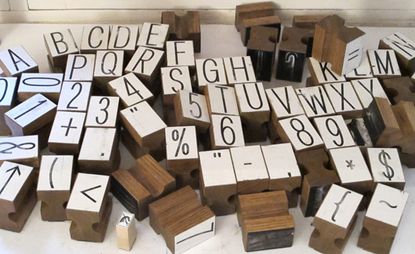Wooden playing blocks with alphabetic , numbers and signs.