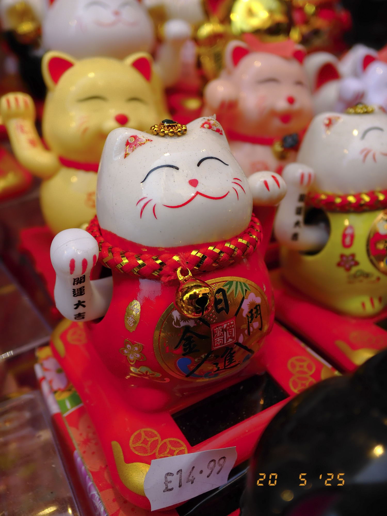 Closeup of maneki-neko in London's china town