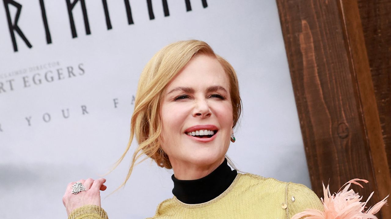 Nicole Kidman&#039;s chic blonde ponytail proves curls are in style as she teams new look with classic tan trench coat