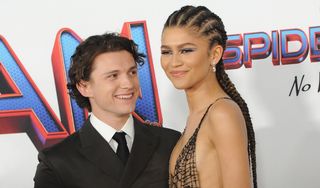 Tom Holland and Zendaya attend Sony Pictures' "Spider-Man: No Way Home" Los Angeles Premiere held at The Regency Village Theatre on December 13, 2021 in Los Angeles, California
