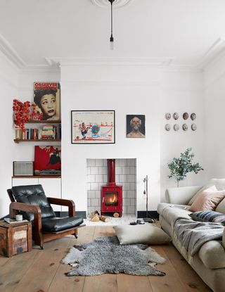 White living room with red wood burner