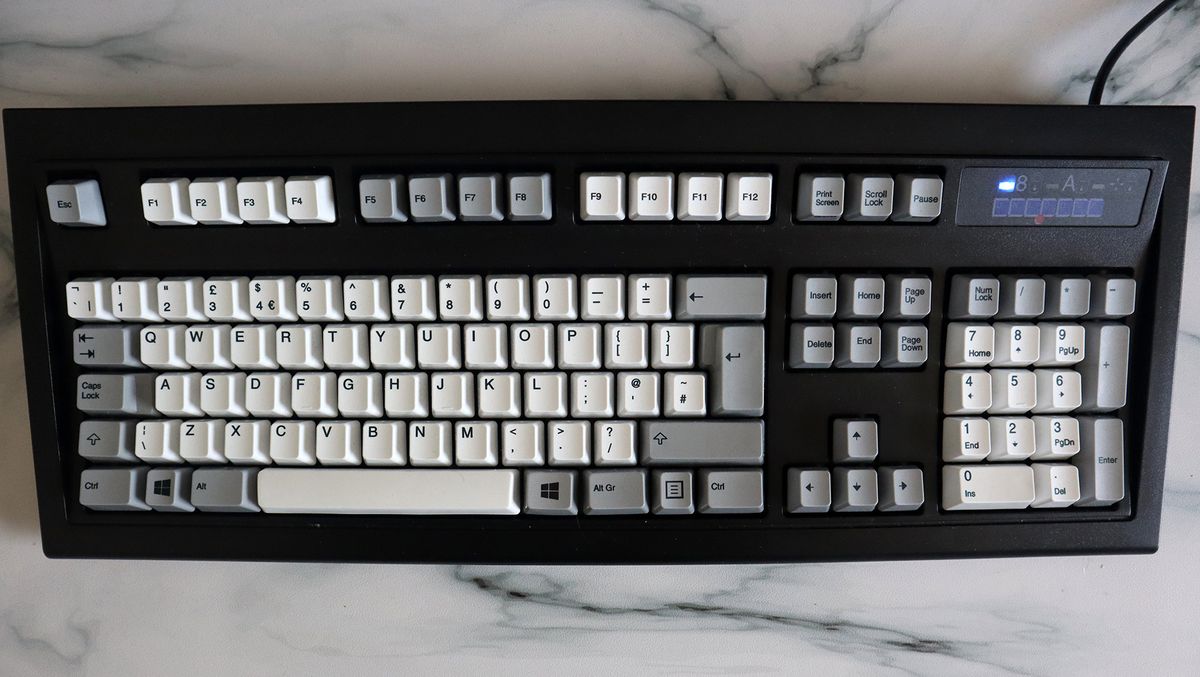 Unicomp New Model M keyboard on a countertop