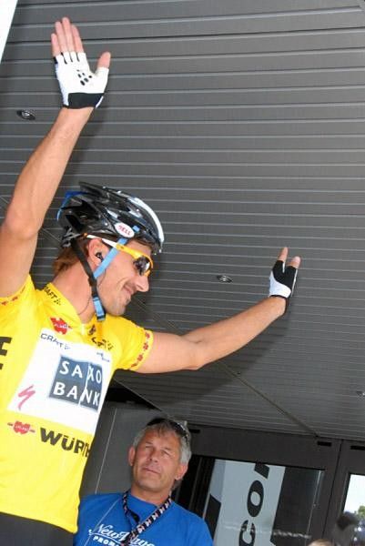 Fabian Cancellara salutes the crowd after signing in for the day.