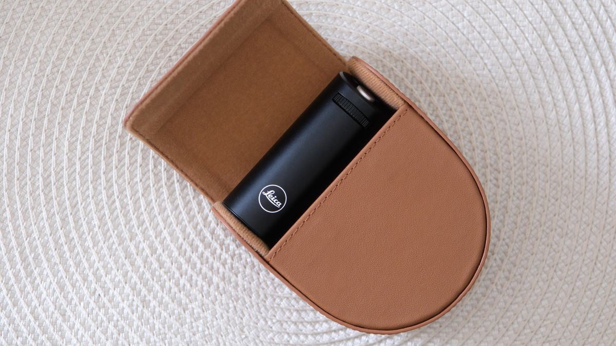 Leica Lux Grip leather case on a beige placemat