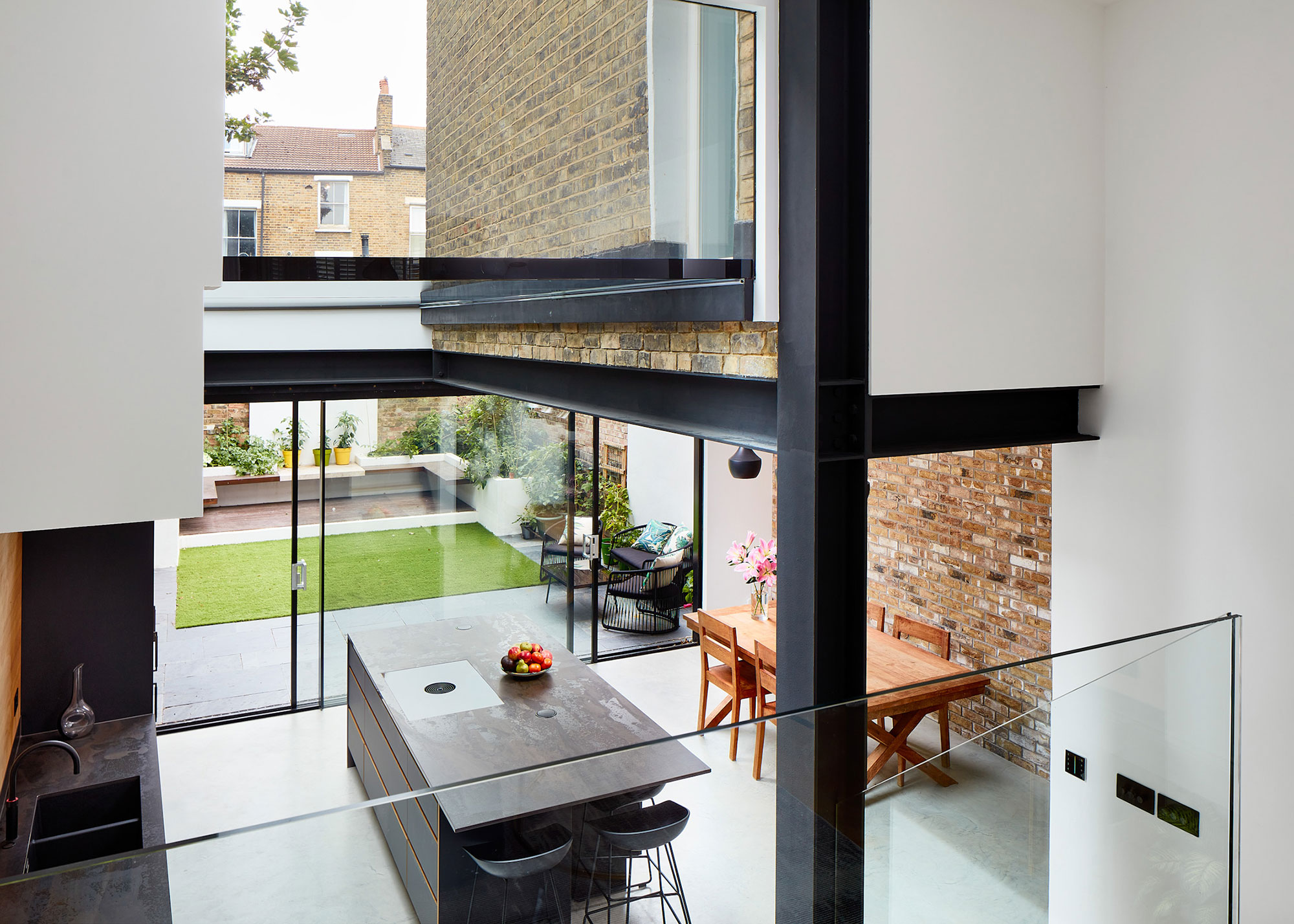 kitchen extension with full height glazing and mezzanine level with sliding doors