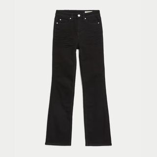 A cutout of black bootcut jeans from M&S on a white backdrop