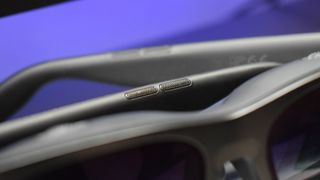 Photo of VITURE Pro XR Glasses with open-ear speakers in focus.