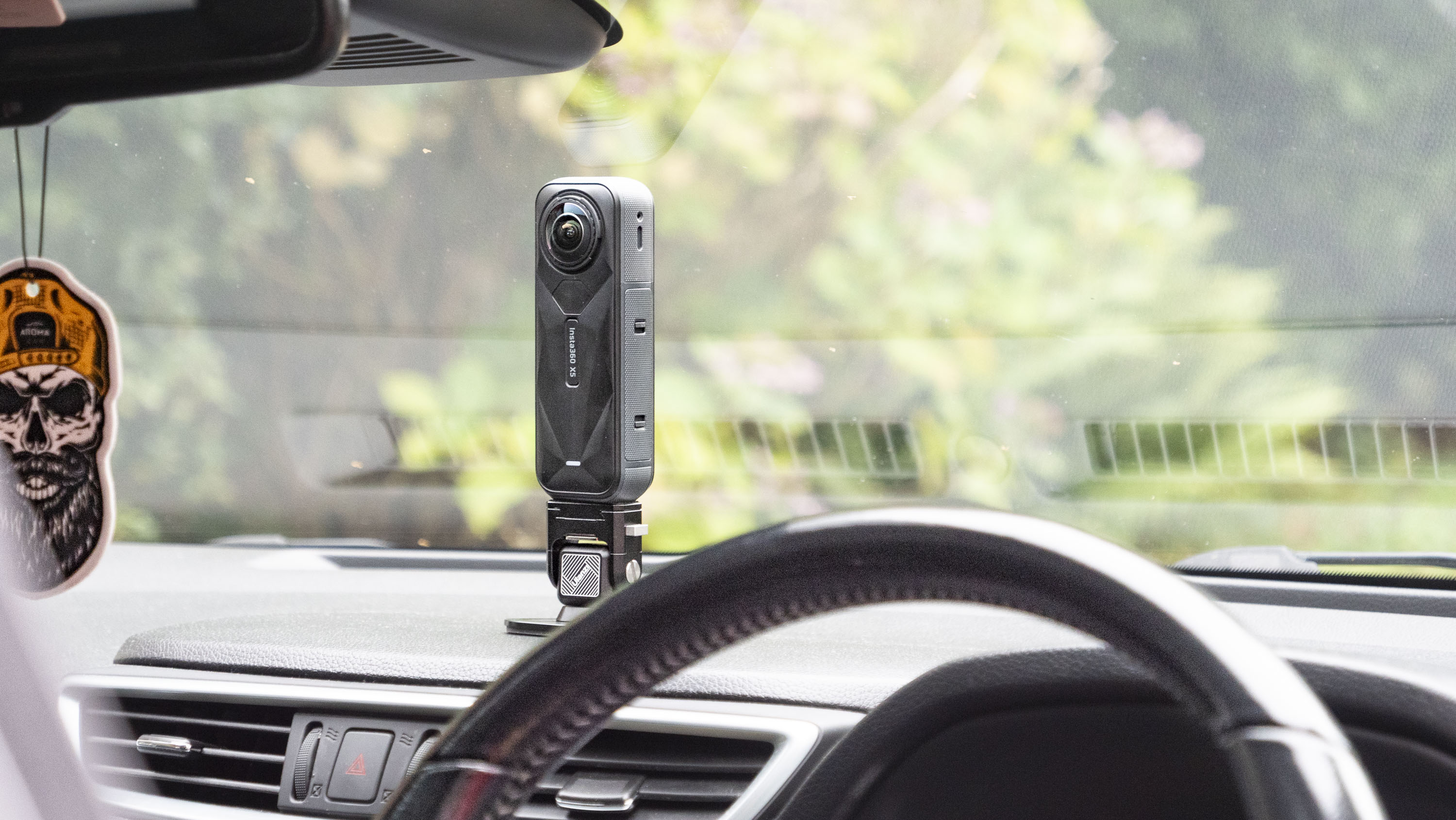 Insta360 X5 mounted to a car&#039;s dashboard