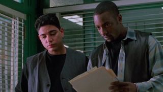 Michael DeLorenzo and Malik Yoba as Eddie and J.C. in the squad room in New York Undercover