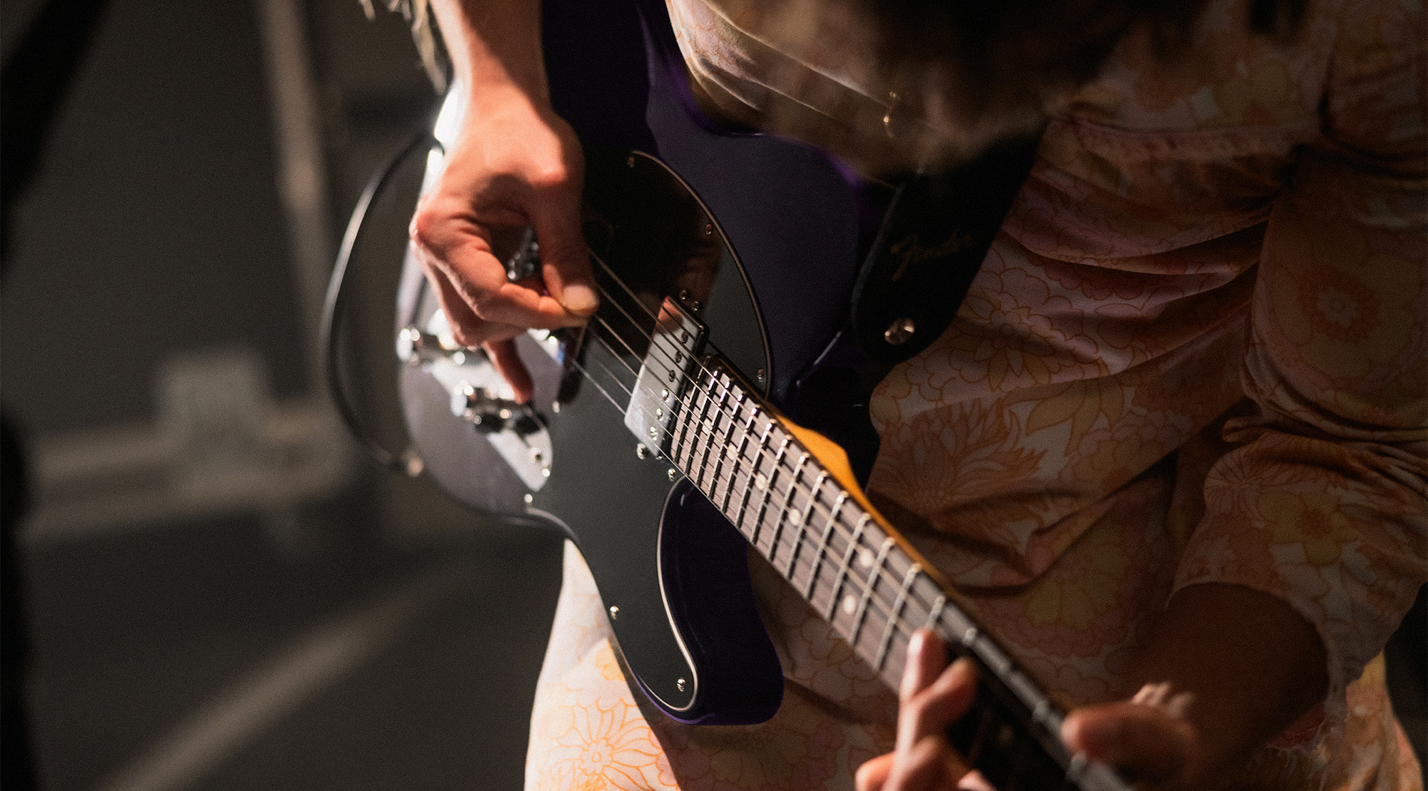A photo of Mark Bowen, guitarist with the band Idles, playing a Fender Player II Modified Telecaster