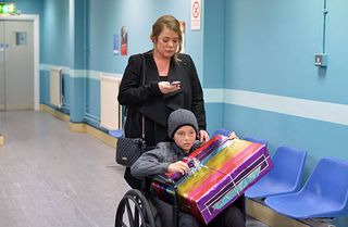WARNING: Embargoed for publication until 00:00:01 on 12/01/2016 - Programme Name: Eastenders - TX: 18/01/2016 - Episode: 5213 (No. n/a) - Picture Shows: Sharon leaves the hospital with Dennis and makes a surprising decision. Sharon Mitchell (LETITIA DEAN), Dennis Rickman (Bleu Landau) - (C) BBC - Photographer: Kieron McCarron