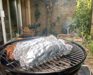 Weber Smokey Joe cooking corn and small bits of meat