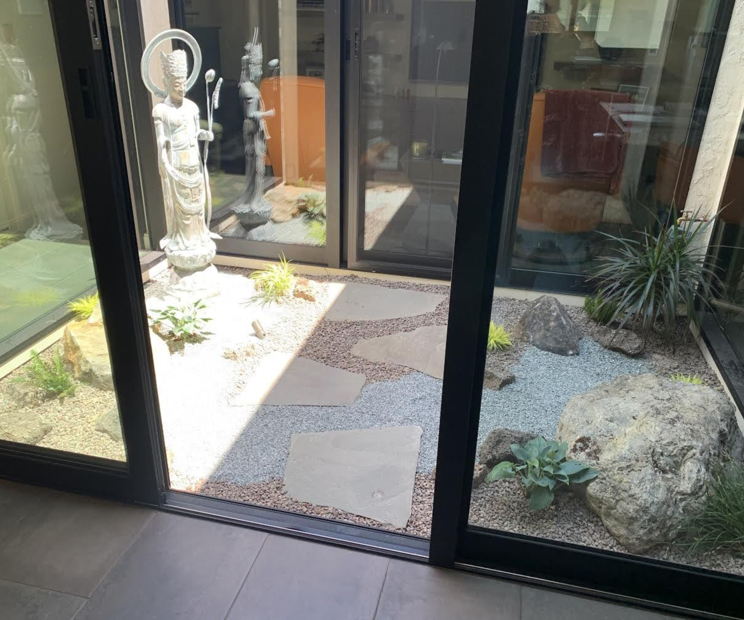 A zen garden atrium with a minimalist design