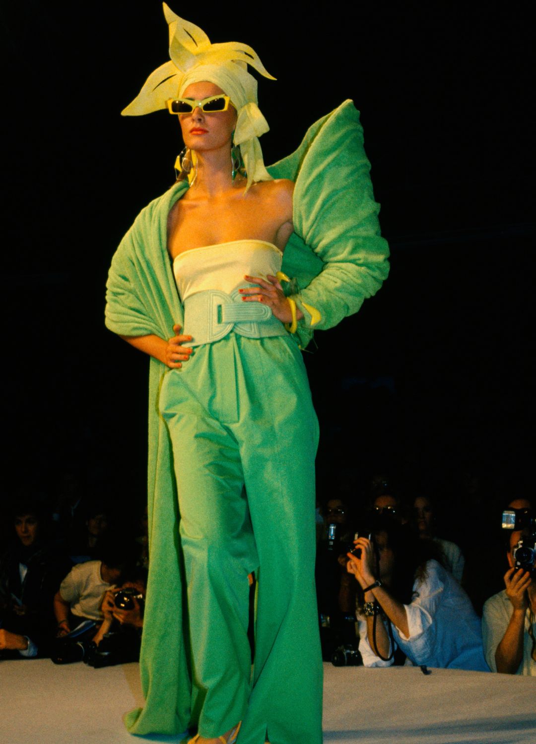 A model walking down the runway at the 1984 Claude Montana Ready to Wear show in Paris.