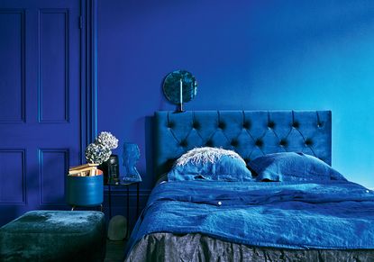 blue bedroom with bright blue walls