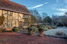 The original 1915 red-brick terrace above the lawn, where Virginia Woolf and other visiting members of the Bloomsbury group would have sat and enjoyed the sun