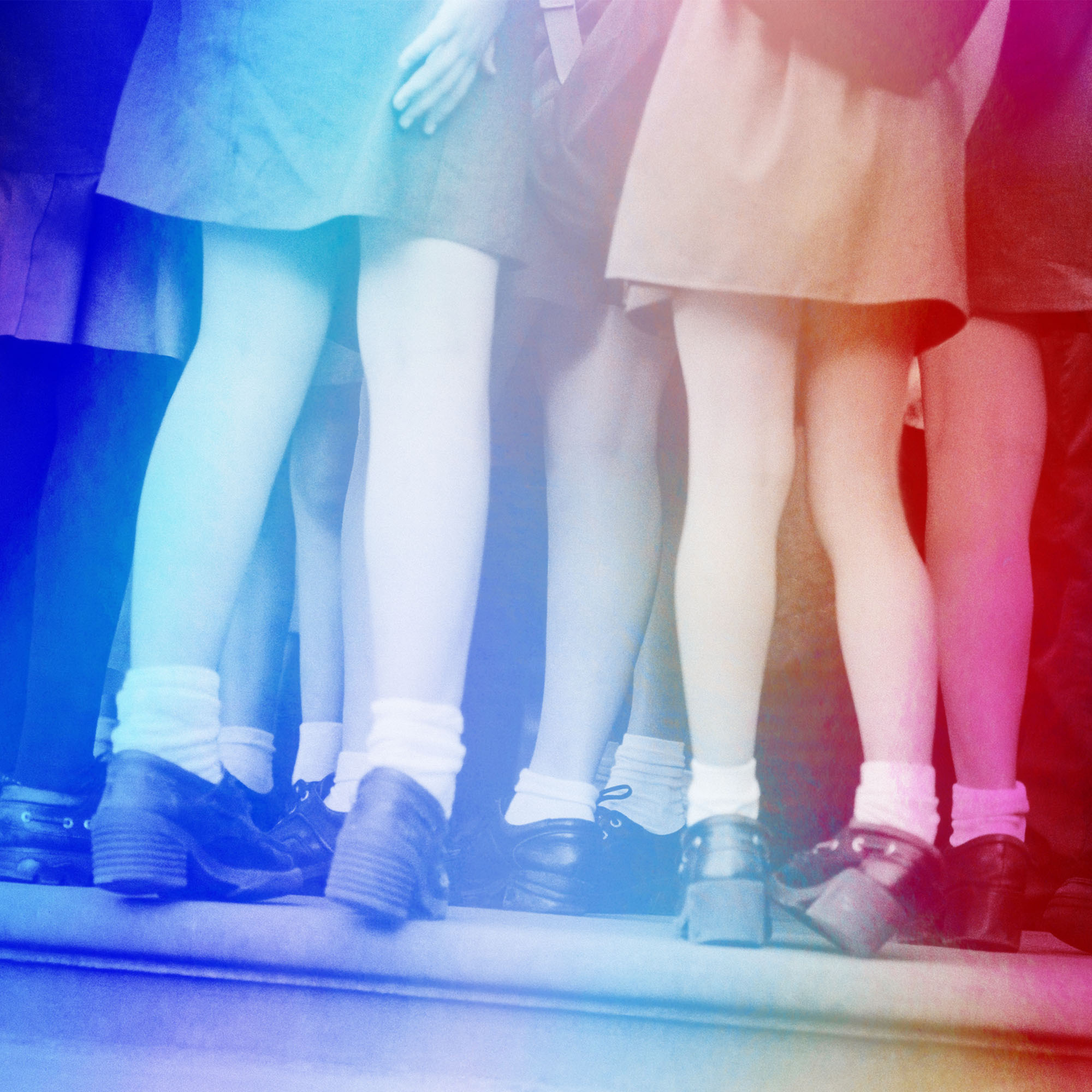 image of schoolgirls&#039; legs covered in a rainbow filter