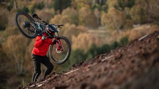 Richard Gasperotti climbing up Mount Etna with his Mondraker Superfoxy mountain bike