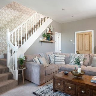 living room with white wall and white paper and stairs