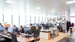 Open plan office with workers at desks