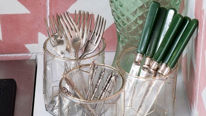Glass jars storing silver cutlery