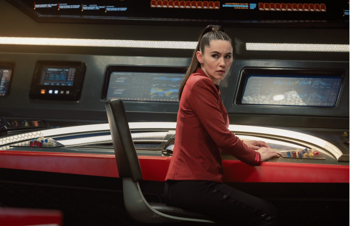 a woman aboard a starship in a sci-fi tv show