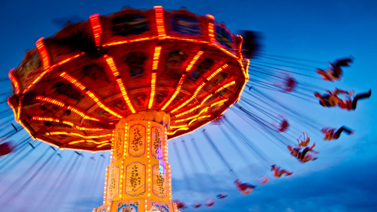 A photo of an amusement park ride where riders rotate on swings.