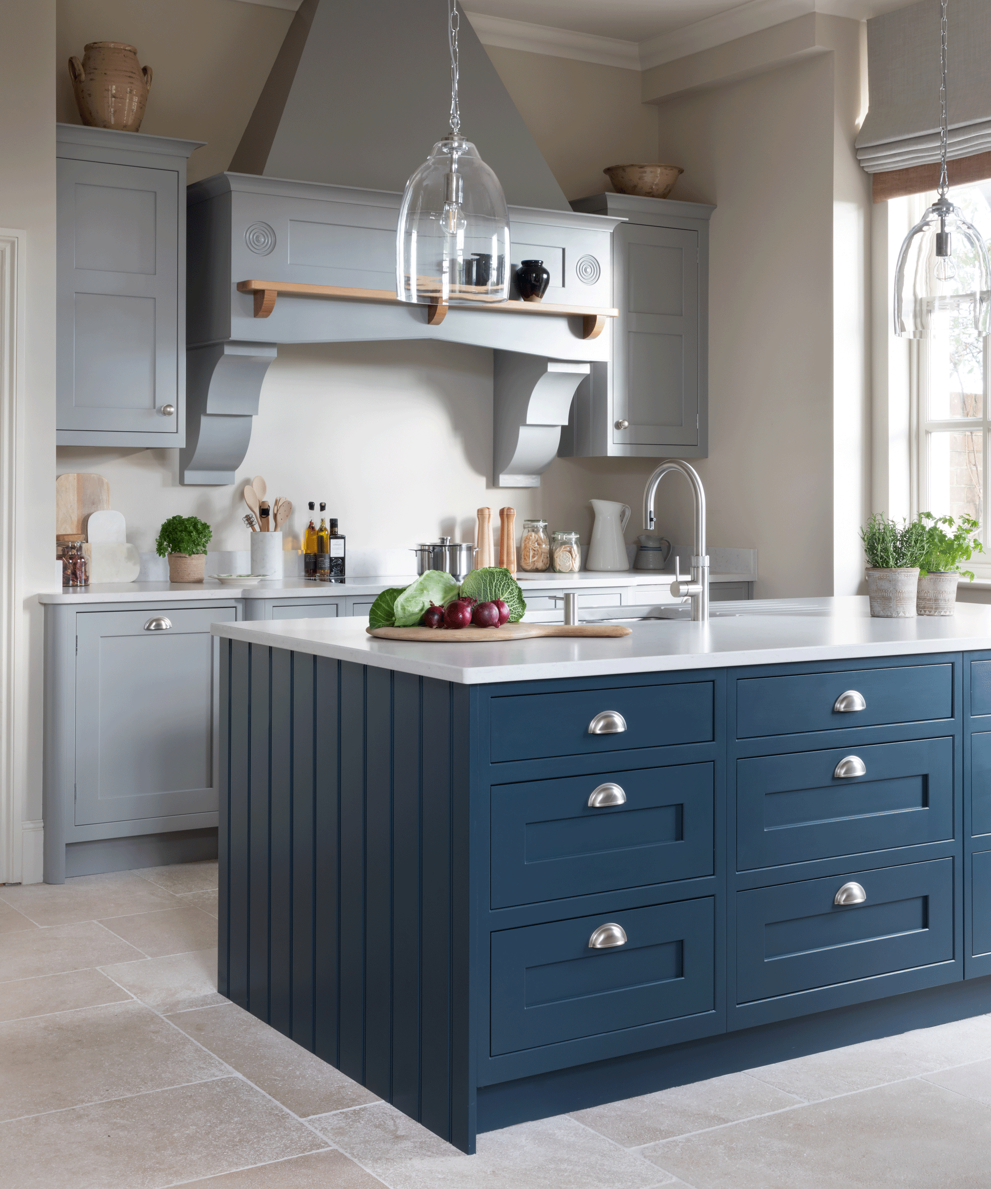 Blue kitchen island and white quartz worktop
