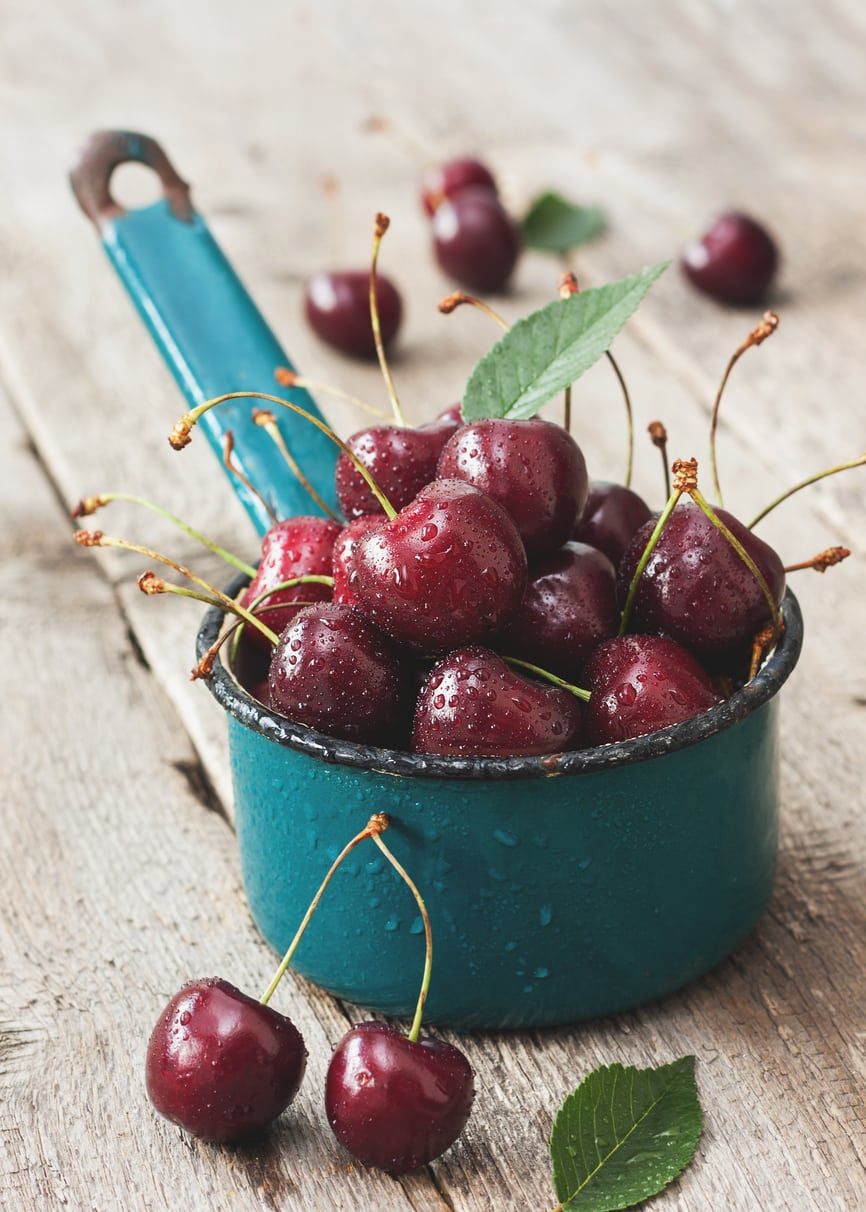 Blue Measuring Cup Full Of Van Cherries