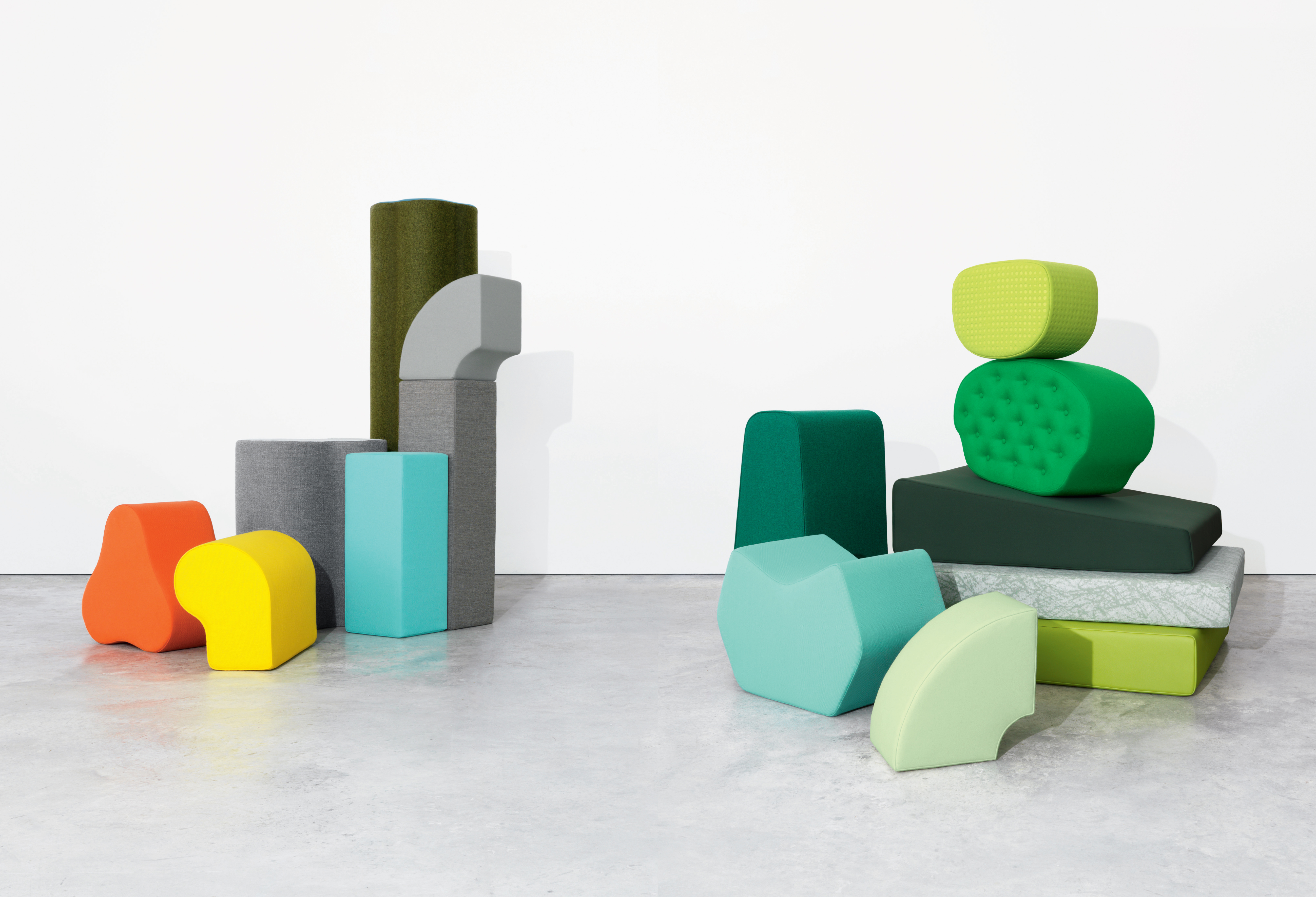 Many different colors of textiles are covering different shapes of furniture.