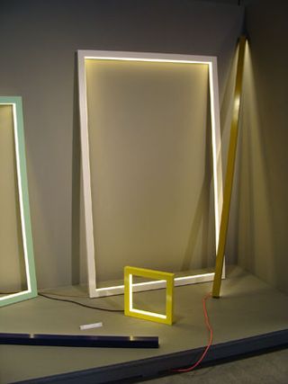 A selection of empty picture frames with light inside the frame