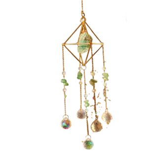 A gold and green crystal suncatcher