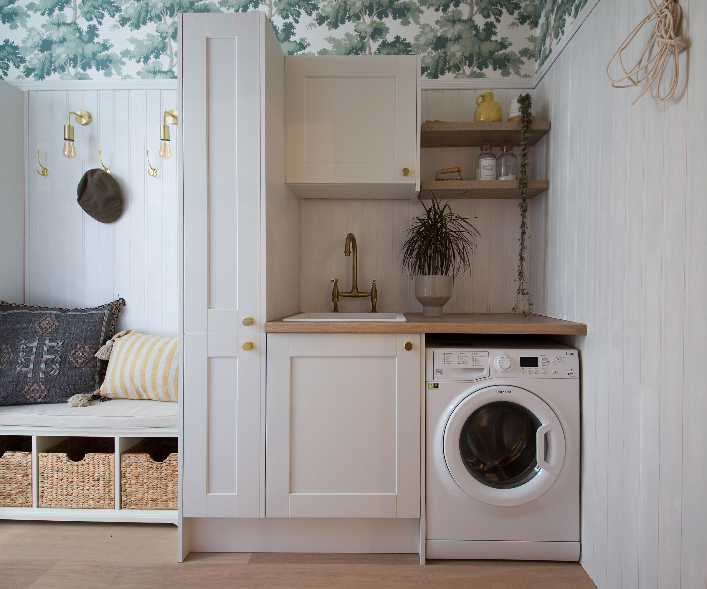 white Shaker utility room with wooden wall panelling and bench seating
