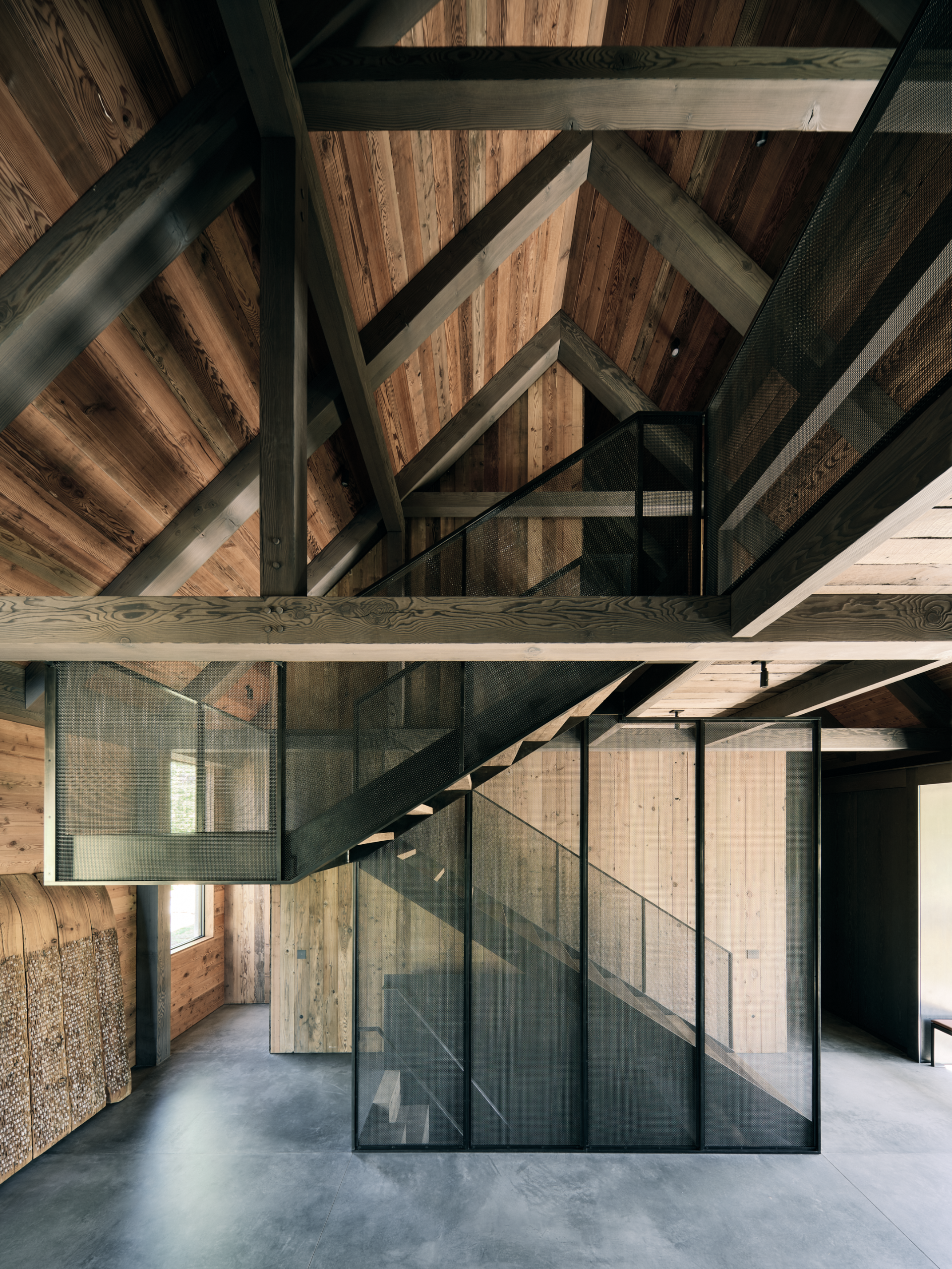 Three Barns by Field Architecture, a rural american home designed to look like a collection of old wooden barns