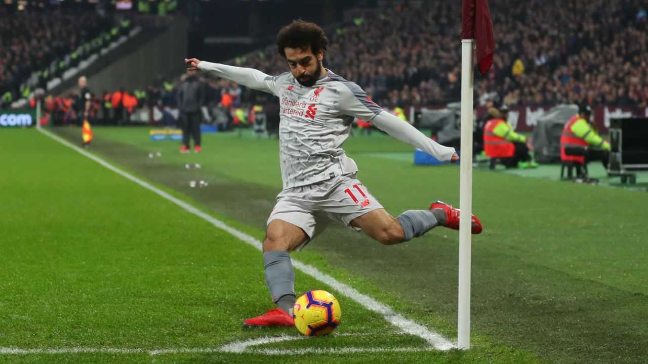 Liverpool striker Mohamed Salah takes a corner against West Ham