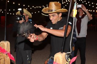 Alberto Contador tries out his quick-draw skills during 'Western Night'